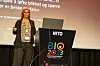Foredragsholder på scene ved NITO-talerstol under BIO 2023.